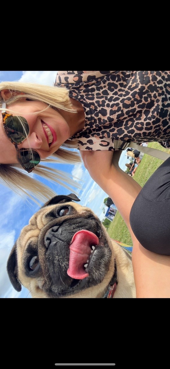 Liz and her pug outdoors