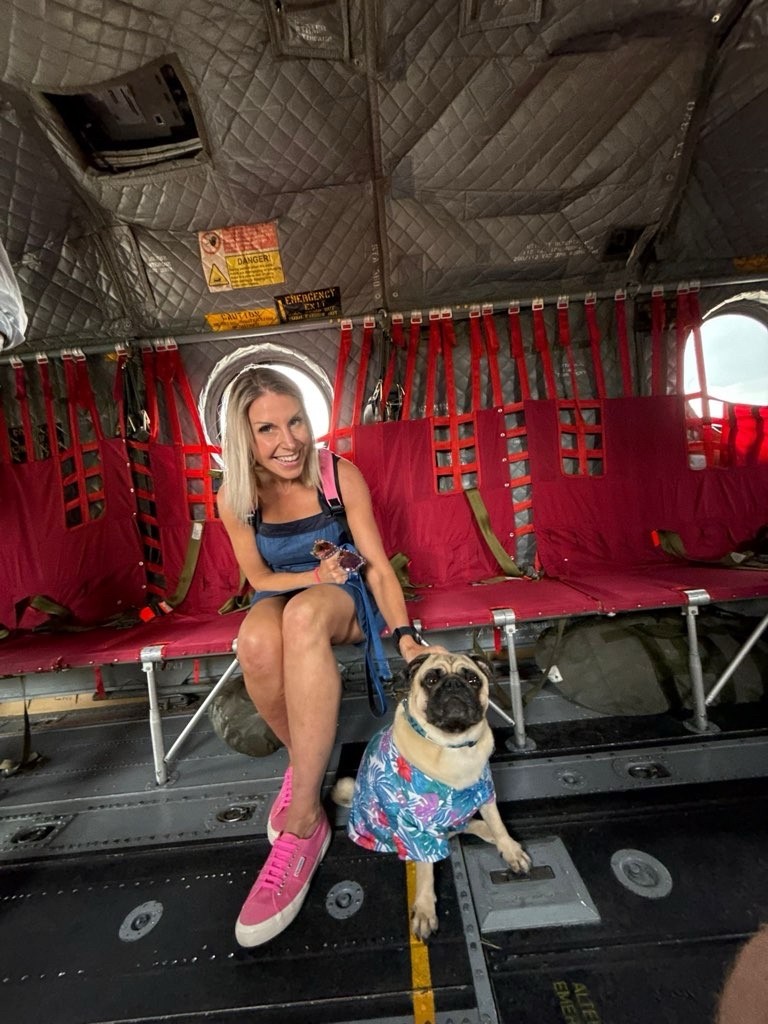 Liz and her pug in a Chinook helicopter